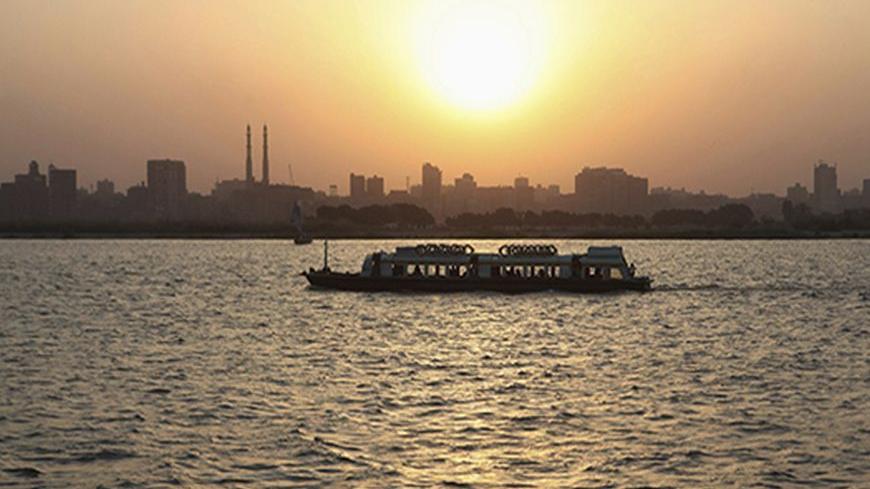 A ferry sails on the river Nile as the sun sets in Cairo May 12, 2013. Most of Egypt's population live clustered around the Nile valley and delta, and the river is both a vital resource for the country's citizens, and a potent national symbol. In a recent dispute with Ethiopia over the construction of a dam upstream, Egypt's foreign minister Mohamed Kamel Amr underlined the country's reliance on the river's waters: "No Nile - no Egypt," he said. Picture taken May 12, 2013. REUTERS/Asmaa Waguih (EGYPT - Tags
