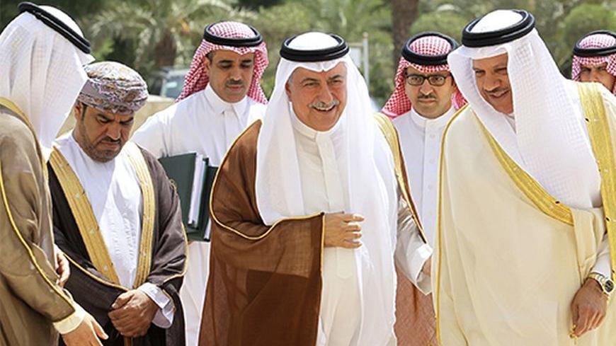Saudi Arabia's Finance Minister Ibrahim Alassaf (front, 2nd R) walks with Gulf Cooperation Council (GCC) Secretary-General Abdulatif al-Zayani (front R) to attend a meeting of Gulf Arab monetary and finance officials in Riyadh October 5, 2013. The central bank of Saudi Arabia, one of the world's top holders of U.S. government bonds, said on Saturday it was not worried by the political deadlock in Washington that could cause the United States to default on its debt. The U.S. Congress must agree on a measure 