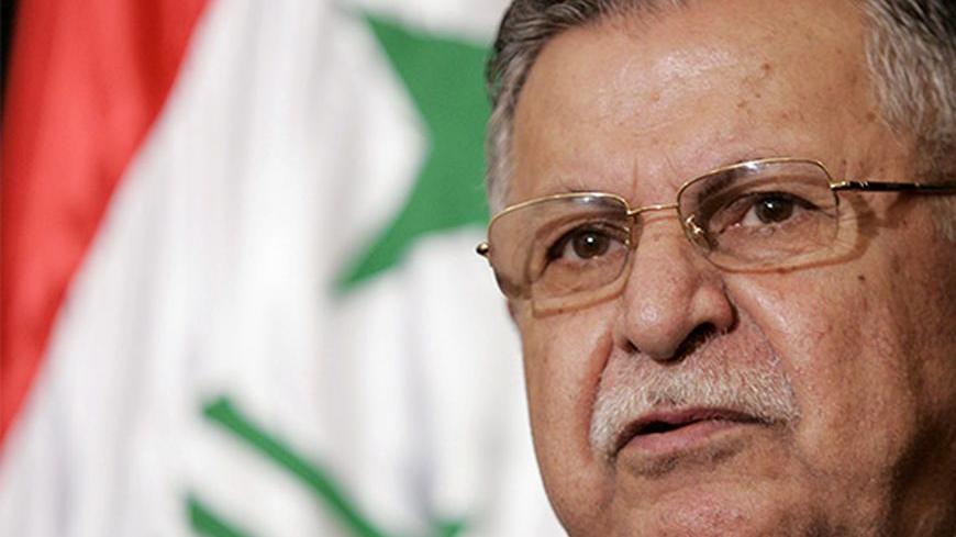Iraqi President Jalal Talabani speaks at a news conference following his meeting with Director of U.S. Foreign Assistance and USAID Administrator Ambassador Randall L. Tobias in the heavily fortified Green Zone in Baghdad May 25, 2006. REUTERS/Ali Haider/Pool - RTR1DQND