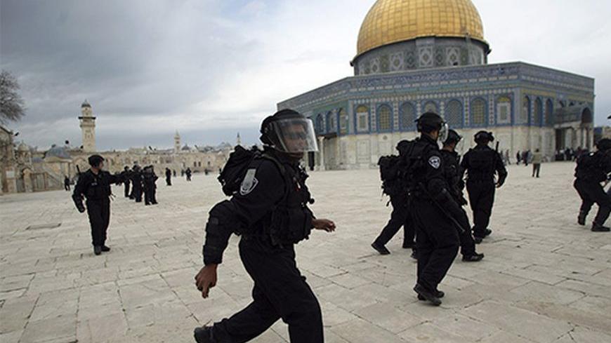 Israeli border police run in front of Dome of the Rock during a protest after Friday prayers at a compound known to Muslims as al-Haram al-Sharif and to Jews as Temple Mount, in Jerusalem's Old City February 22, 2013. Palestinian protesters have said they fear for the life of Samer al-Issawi, who has been on intermittent hunger strike for over 200 days, and three other hunger strikers jailed by Israel. Their cases have been at the centre of intensified clashes with Israeli soldiers throughout the Israeli-oc