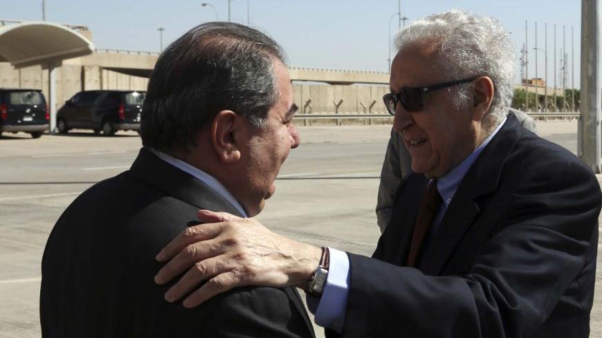 U.N. envoy to Syria, Lakhdar Brahimi (R), is welcomed by Iraqi Foreign Minister Hoshyar Zebari after arriving at Baghdad International Airport October 21, 2013. International envoy for Syria Brahimi was in Baghdad on Monday to discuss dates for peace talks aimed at ending the war in Syria. Brahimi said no date had yet been set for the long-delayed conference. International efforts to end the 2-1/2 year conflict that has killed more than 100,000 people have stuttered. But a deal last month for Syria to get r