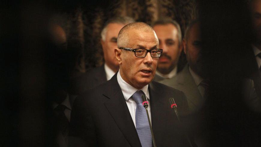 Libya's Prime Minister Ali Zeidan speaks during a news conference at the headquarters of the prime minister's office in Tripoli October 11, 2013. Zeidan said on Friday former rebels who abducted him briefly were part of an attempted "coup" by his opponents in the country's legislature, accusing them of seeking to undermine his government. REUTERS/Ismail Zitouny (LIBYA - Tags: POLITICS CIVIL UNREST) - RTX147NX