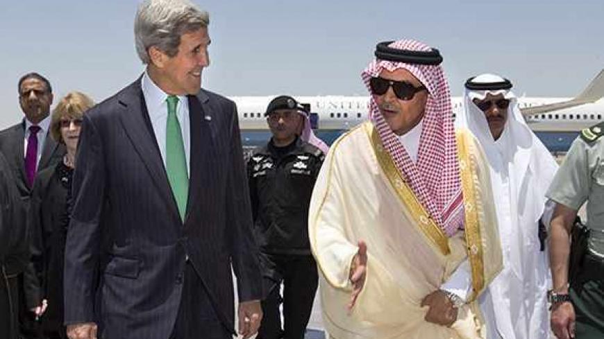 U.S. Secretary of State John Kerry (L) is greeted by Saudi Arabia's Foreign Minister Prince Saud al-Faisal upon arrival in Jeddah, Saudi Arabia June 25, 2013. Kerry is in Saudi Arabia for a day visit and will continue on to Kuwait, as he returns to his Middle East tour after stopping in India. REUTERS/Jacquelyn Martin/Pool (SAUDI ARABIA - Tags: POLITICS) - RTX11038