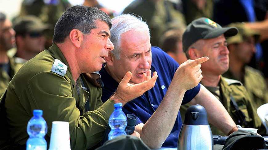 Israel's Prime Minister Benjamin Netanyahu (C) and army chief Lieutenant-General Gabi Ashkenazi (L) observe a military exercise at Elyakim military base near the northern city of Haifa May 11, 2010. QUALITY FROM SOURCE. REUTERS/Eran Yuppy Cohen/Pool (ISRAEL - Tags: POLITICS MILITARY) - RTR2DQUY