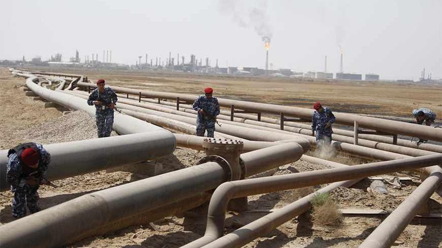 Policemen check oil pipelines during a patrol in Shueiba refinery in Iraq's southern province of Basra August 26, 2010. Baghdad has signed multi-billion deals with oil firms to boost output capacity to 12 million barrels a day in seven years, rivalling top oil exporter Saudi Arabia. That could give Iraq the money it needs to rebuild after decades of war, sanctions and economic degradation. But everything depends on whether the OPEC member can secure its vital oilfields, refineries and other infrastructure a
