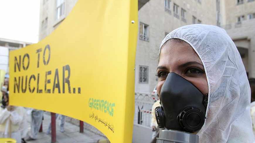 A Jordanian environmental activist takes part in a protest against Jordan's nuclear program in front of the ministry of energy in Amman June 29, 2011. Jordan is currently planning its first 1,000 megawatt nuclear power plant, although it has recently shifted away from an initially proposed site in an earthquake fault zone. REUTERS/Muhammad Hamed (JORDAN - Tags: POLITICS CIVIL UNREST ENERGY) - RTR2O9DG