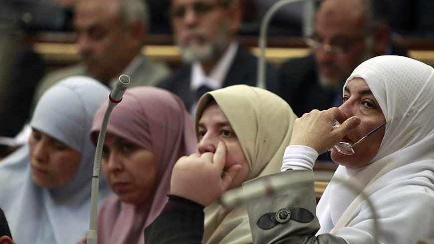 Female Members of Parliament, who are also members of the Freedom and Justice Party of the Muslim Brotherhood, attend a parliament session in Cairo February 26, 2012. Egypt's military rulers invited the parliament's two houses to convene on Saturday to elect an assembly tasked with writing the country's first constitution since the overthrowing of former President Hosni Mubarak. REUTERS/Amr Abdallah Dalsh  (EGYPT - Tags: CIVIL UNREST POLITICS) - RTR2YH3N