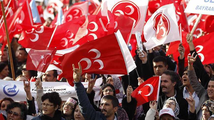 Supporters of the Nationalist Movement Party (MHP) make the grey wolf sign of the party as they wait for the arrival of party leader Devlet Bahceli during a rally in Istanbul October 5, 2013. REUTERS/Osman Orsal (TURKEY - Tags: POLITICS ) - RTR3FMK7
