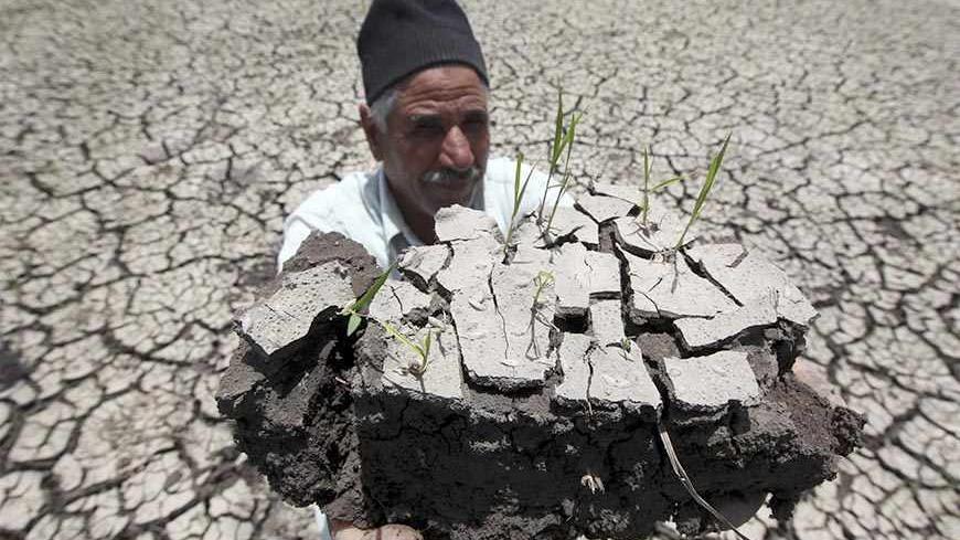 An Egyptian farmer holds a handful of soil to show the dryness of the land due to drought in a farm formerly irrigated by the river Nile, in Al-Dakahlya, about 120 km (75 miles) from Cairo June 4, 2013. Ethiopia has not thought hard enough about the impact of its ambitious dam project along the Nile, Egypt said on Sunday, underlining how countries down stream are concerned about its impact on water supplies. The Egyptian presidency was citing the findings of a report put together by a panel of experts from 