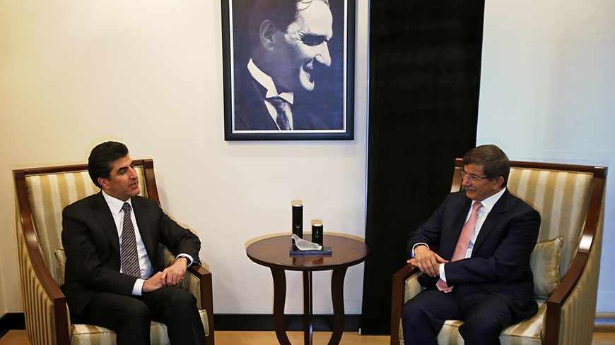Turkey's Foreign Minister Ahmet Davutoglu (R) meets with Iraq's Kurdish Regional Government (KRG) Prime Minister Nechirvan Barzani in Ankara July 30, 2013.    REUTERS/Umit Bektas (TURKEY - Tags: POLITICS) - RTX1252R