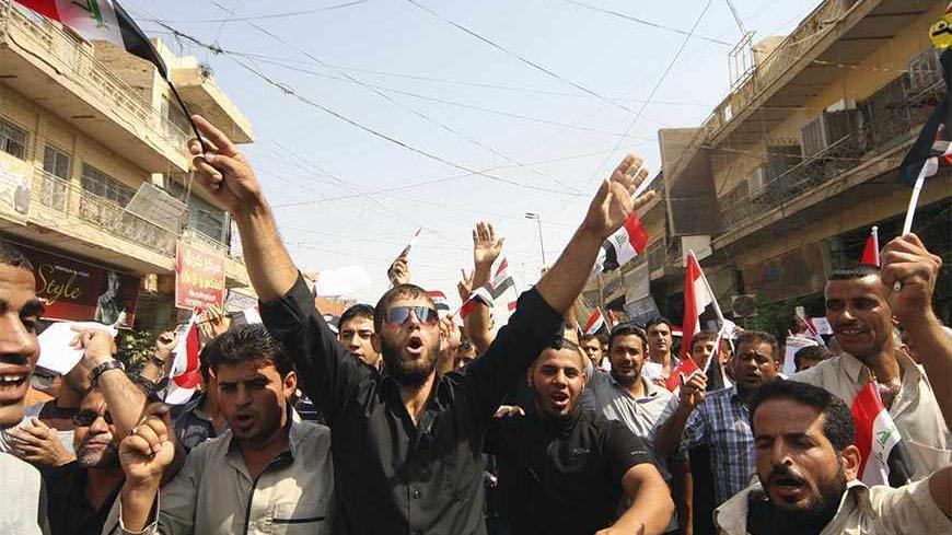 Protesters demand that the pensions of parliamentarians be cancelled during a demonstration in Kerbala, 110 km (68 miles) south of Baghdad, August 31, 2013. Hundreds of protesters took to the streets in Baghdad and central and southern Iraq on Saturday against generous pension payments to lawmakers in a county where many are still struggling to get jobs and basic services.  REUTERS/Mushtaq Muhammed (IRAQ - Tags - Tags: POLITICS BUSINESS EMPLOYMENT SOCIETY CIVIL UNREST) - RTX132K4