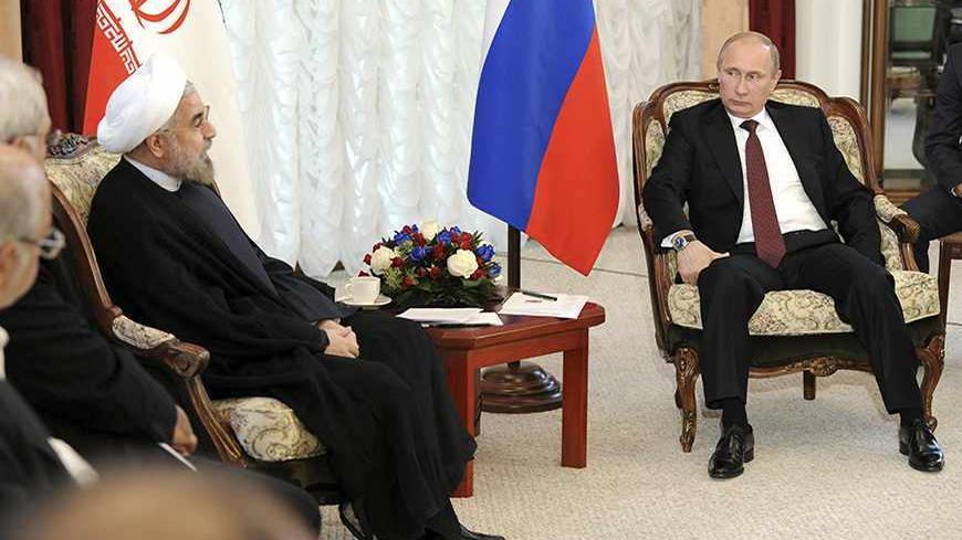 Russia's President Vladimir Putin (R) meets with his Iranian counterpart Hassan Rouhani during the Shanghai Cooperation Organization (SCO) summit in Bishkek, September 13, 2013. Rouhani said on Friday that he wanted a swift resolution to a dispute over Tehran's nuclear programme, which Western states fear is aimed at developing nuclear weapons.  REUTERS/Mikhail Klimentyev/RIA Novosti/Kremlin (KYRGYZSTAN - Tags: POLITICS) ATTENTION EDITORS - THIS IMAGE HAS BEEN SUPPLIED BY A THIRD PARTY. IT IS DISTRIBUTED, E