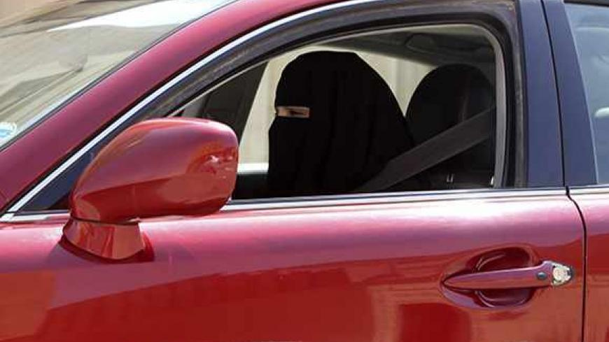 A woman drives a car in Saudi Arabia October 22, 2013. A conservative Saudi Arabian cleric has said women who drive risk damaging their ovaries and bearing children with clinical problems, countering activists who are trying to end the Islamic kingdom's male-only driving rules. Saudi Arabia is the only country in the world where women are barred from driving, but debate about the ban, once confined to the private sphere and social media, is increasingly spreading to public forums too. REUTERS/Faisal Al Nass