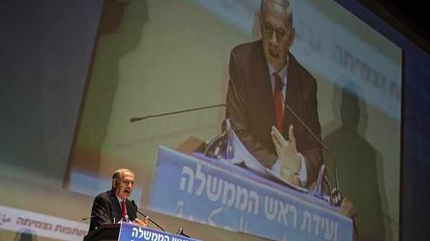 Israel's Prime Minister Benjamin Netanyahu speaks at a conference in Tel Aviv University October 29, 2013. A planned release of 26 Palestinian prisoners has provoked feuding within Israel's governing coalition, already under strain from U.S.-brokered peace talks. Jewish Home, led by Naftali Bennett, then tried to get a proposal to freeze further prisoner releases past a ministerial committee, where members Netanyahu's Likud party voted it down on Sunday.    REUTERS/ Nir Elias (ISRAEL - Tags: POLITICS) - RTX