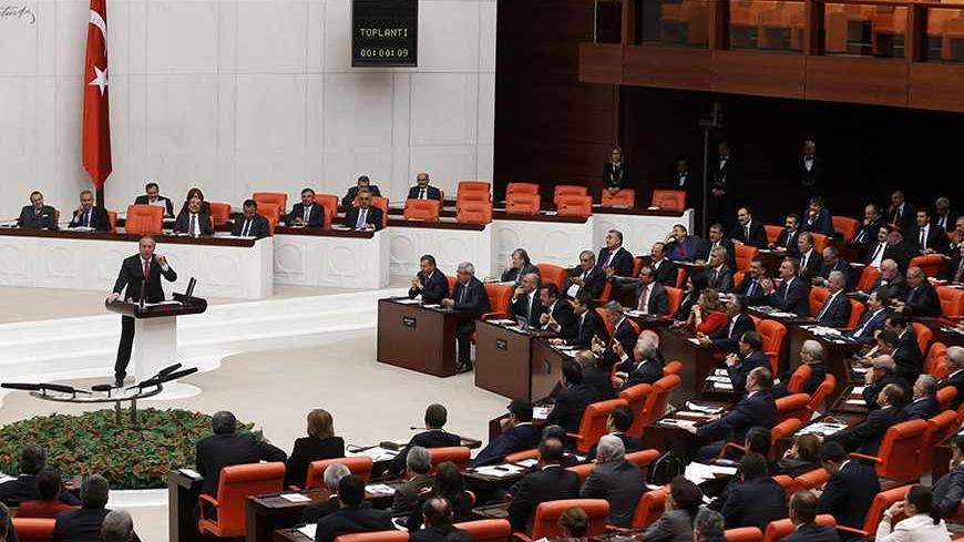Turkey's main opposition Republican People's Party (CHP) lawmaker Muharrem Ince addresses the Turkish Parliament in Ankara October 31, 2013. Four female lawmakers from Turkey's Islamist-rooted ruling party wore their Islamic head scarves in parliament on Thursday in a challenge to the country's secular tradition. Four female lawmakers, Nurcan Dalbudak, Sevde Beyazit Kacar, Gulay Samanci and Gonul Bekin Sahkulubey, from Turkey's Islamist-rooted ruling party AKP wore their Islamic head scarves in parliament o