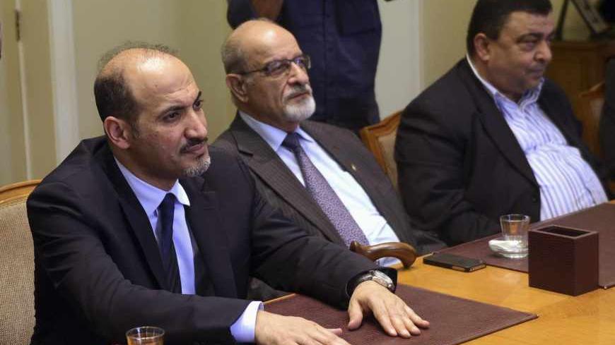 President of the Syrian National Coalition, Ahmad Al-Jarba (L), looks on during a meeting with Arab League Secretary General Nabil al-Arabi (not pictured) in Cairo, November 2, 2013. Arab League Foreign Ministers will meet in Cairo in an emergency session to discuss the ongoing crisis in Syria on Sunday. REUTERS/Stringer (EGYPT - Tags: POLITICS) - RTX14XDS
