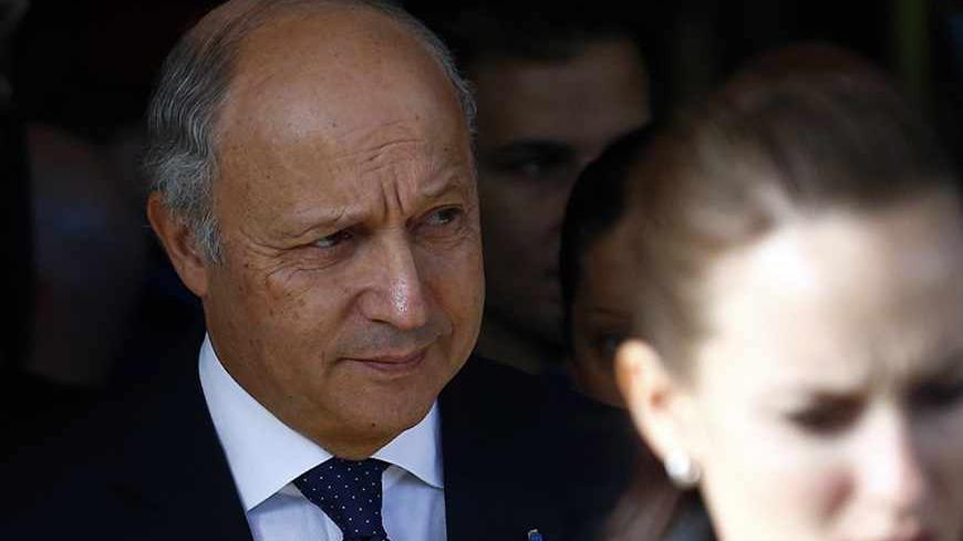 French Foreign Minister Laurent Fabius leaves the Intercontinental hotel on the third day of closed-door nuclear talks with Iran in Geneva November 9, 2013.  REUTERS/Denis Balibouse (SWITZERLAND - Tags: POLITICS ENERGY HEADSHOT) - RTX156G4