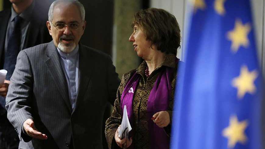 European Union foreign policy chief Catherine Ashton (R) and Iranian Foreign Minister Mohammad Javad Zarif arrive at a news conference at the end of the Iranian nuclear talks in Geneva November 10, 2013.  REUTERS/Jason Reed   (SWITZERLAND - Tags: POLITICS TPX IMAGES OF THE DAY) - RTX1578B