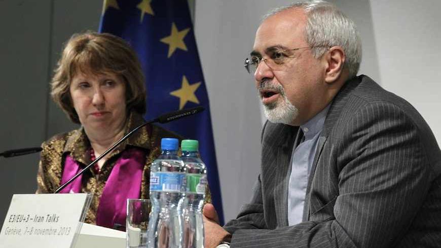 European Union foreign policy chief Catherine Ashton listens as Iranian Foreign Minister Mohammad Javad Zarif (R) speaks during a news conference at the end of the Iranian nuclear talks in Geneva November 10, 2013. Zarif and Ashton said on Sunday they hoped Iran and six world powers would reach an agreement when they gather again in 10 days, adding that the latest round of talks on Tehran's nuclear programme was something all delegations can build on.  REUTERS/Jason Reed   (SWITZERLAND - Tags: POLITICS) - R