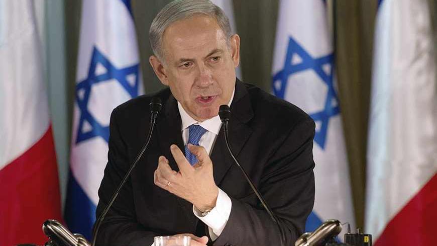 Israel Prime Minister Benjamin Netanyahu speaks during a joint news conference with French President Francois Hollande (not pictured) at his residence in Jerusalem November 17, 2013.  President Hollande assured Israel on Sunday that France would continue to oppose an easing of economic sanctions against Iran until it was convinced Tehran had ended a pursuit of nuclear weapons. REUTERS/Alain Jocard/Pool (JERUSALEM - Tags: POLITICS) - RTX15HKF