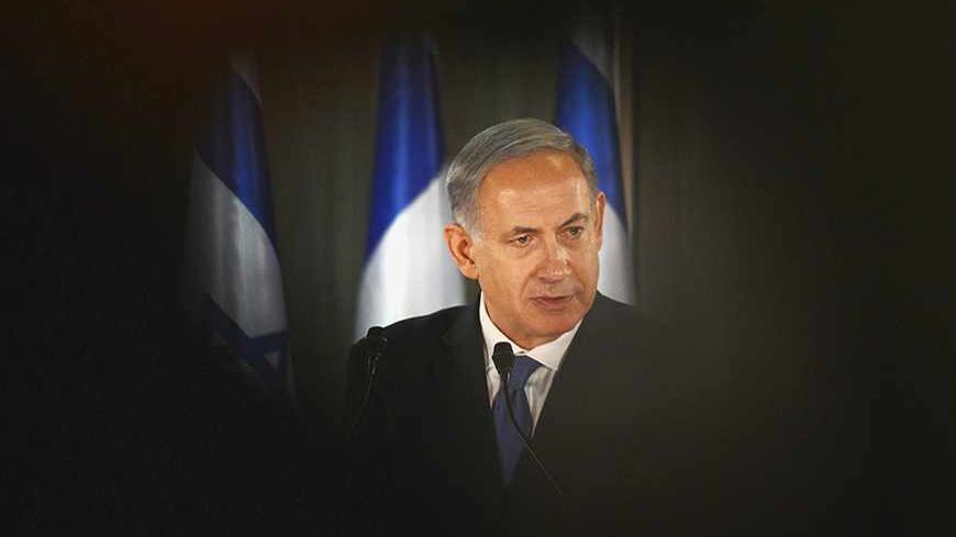 Israel Prime Minister Benjamin Netanyahu speaks during a joint news conference with French President Francois Hollande (not pictured) at his residence in Jerusalem November 17, 2013. President Hollande assured Israel on Sunday that France would continue to oppose an easing of economic sanctions against Iran until it was convinced Tehran had ended a pursuit of nuclear weapons. REUTERS/Alain Jocard/Pool (JERUSALEM - Tags: POLITICS) - RTX15HKI