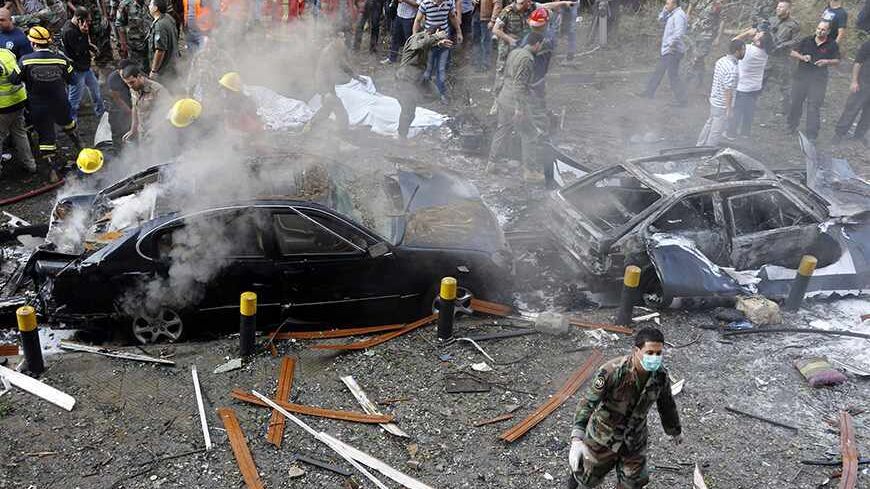 ATTENTION EDITORS - VISUAL COVERAGE OF SCENES OF INJURY OR DEATH
Soldiers, policemen and medical personnel gather at the site of explosions near the Iranian embassy in Beirut November 19, 2013. Two explosions targeting the Iranian embassy hit the Lebanese capital Beirut on Tuesday, security sources said, killing at least seven people and damaging buildings in the embassy compound.     REUTERS/ Mohamed Azakir        (LEBANON - Tags: CIVIL UNREST POLITICS) 
TEMPLATE OUT - RTX15JO7