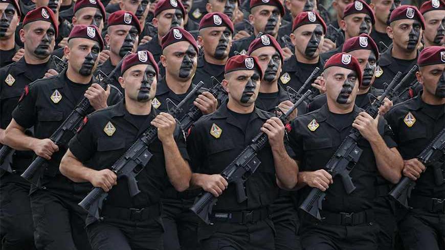 Lebanese commandos take part in a military parade to celebrate the 70th anniversary of Lebanon's independence in downtown Beirut November 22, 2013. REUTERS/Mohamed Azakir (LEBANON - Tags: ANNIVERSARY POLITICS MILITARY) - RTX15OGS