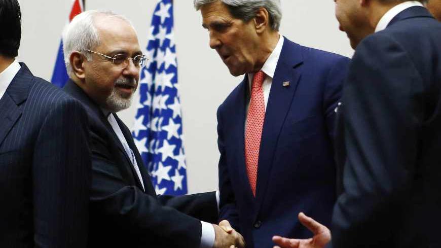 U.S. Secretary of State John Kerry (R) shakes hands with Iranian Foreign Minister Mohammad Javad Zarif after a ceremony at the United Nations in Geneva November 24, 2013. Iran and six world powers reached a breakthrough agreement early on Sunday to curb Tehran's nuclear programme in exchange for limited sanctions relief, in a first step towards resolving a dangerous decade-old standoff. REUTERS/Denis Balibouse (SWITZERLAND - Tags: POLITICS ENERGY) - RTX15QM8