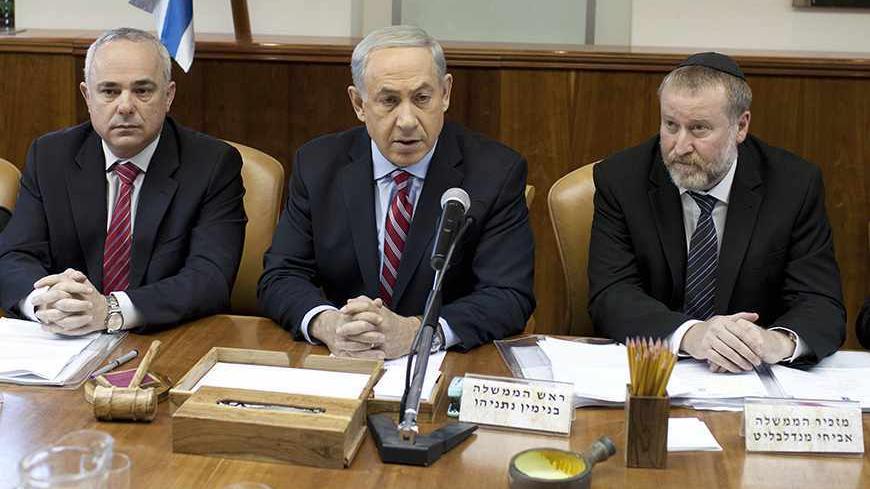 Israel's Prime Minister Benjamin Netanyahu (C) attends the weekly cabinet meeting in Jerusalem November 24, 2013. Netanyahu on Sunday denounced the world powers' nuclear agreement with Iran as a historic mistake that left the production of atomic weapons within Tehran's reach. REUTERS/Abir Sultan/Pool (JERUSALEM - Tags: POLITICS) - RTX15QWE
