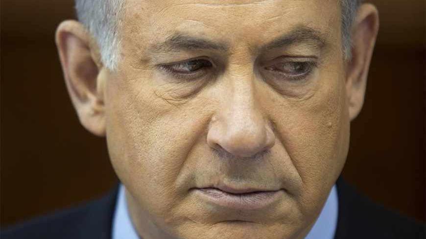 Israel's Prime Minister Benjamin Netanyahu attends the weekly cabinet meeting in Jerusalem November 24, 2013. Netanyahu on Sunday denounced the world powers' nuclear agreement with Iran as a historic mistake that left the production of atomic weapons within Tehran's reach. REUTERS/Abir Sultan/Pool (JERUSALEM - Tags: POLITICS) - RTX15R02