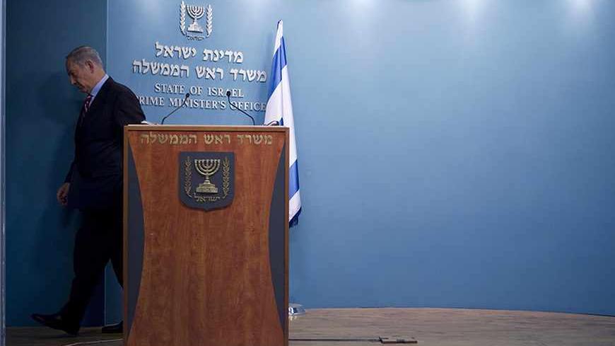 Israel's Prime Minister Benjamin Netanyahu leaves after delivering a statement at his office in Jerusalem November 24, 2013. Netanyahu on Sunday denounced the world powers' nuclear agreement with Iran as a historic mistake that left the production of atomic weapons within Tehran's reach. REUTERS/Baz Ratner (JERUSALEM - Tags: POLITICS) - RTX15R0J