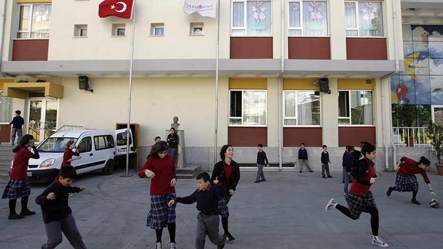 Children play at the garden of Fatih College in Istanbul April 16, 2008. The 640-pupil school is run by followers of Fethullah Gulen, a Turkish Muslim preacher who advocates moderate Islam rooted in modern life, and whose teachings have inspired millions of Turks to forge a powerful socio-religious community active in publishing, charity and above all education. The Gulen movement has built up a network of some 800 schools around the world, teaching a full curriculum but with a strong focus on science and t