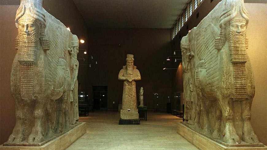 Monumental Assyrian works stand in a gallery of the Iraq Museum in Baghdad. The authorities closed the museum and removed most of its other treasures to secret hiding places during the 1990-91 Gulf crisis, but are now considering plans with UNESCO to put them back on show. (Picture taken 30NOV98) - RTXHUYE