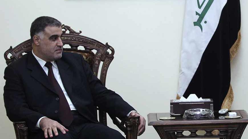 Iraq's Deputy Prime Minister Rafi Essawi (R) meets with Hassan al-Shammari, head of the Iraqi Islamic al Fadila parliamentary bloc, in Baghdad October 1, 2010. REUTERS/Mohammed Ameen (IRAQ - Tags: POLITICS) - RTXSX67