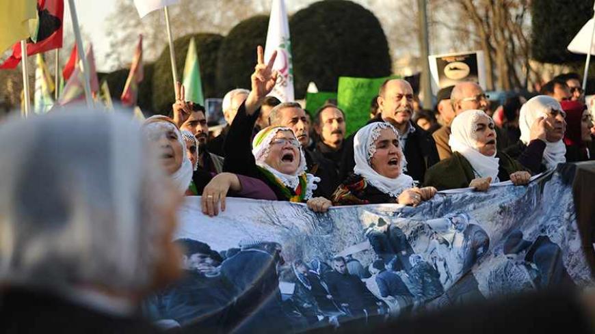 Kurdish people chant slogans during a march on December 28, 2013 in Istanbul marking the second anniversary of the December 28, 2011 killing of 34 Turkish-Kurdish civilians working as smugglers at the Turkey-Iraq border in a botched raid by Turkish military jets, known as the Roboski strike, that mistook the group for Kurdistan Workers' Party (PKK) militants. AFP PHOTO / OZAN KOSE        (Photo credit should read OZAN KOSE/AFP/Getty Images)