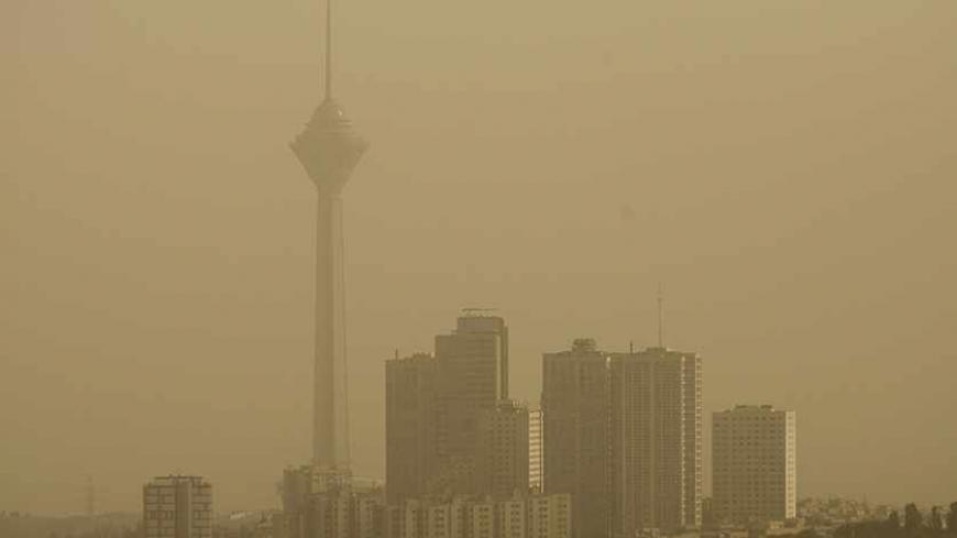 EDITORS' NOTE: Reuters and other foreign media are subject to Iranian restrictions on their ability to film or take pictures in Tehran.
A general view shows Tehran's Milad telecommunication tower (L) as the city is covered in dust July 6, 2009. The government closed private educational centres, state offices, industrial units and military bases for two days and raised its pollution alert status due to the dust, which an official from Tehran's environment office attributed the source to dust from dried marsh