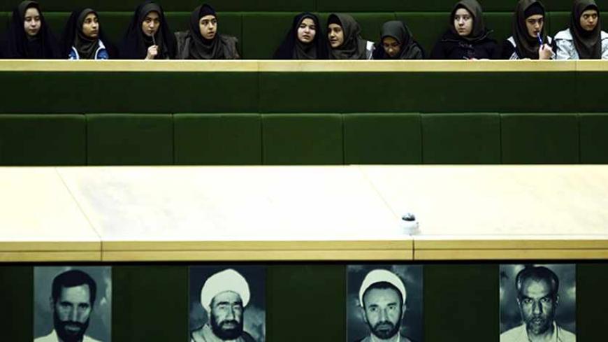 EDITORS' NOTE: Reuters and other foreign media are subject to Iranian restrictions on their ability to film or take pictures in Tehran.
Students attend a parliament session in Tehran January 29, 2012. REUTERS/Raheb Homavandi  (IRAN - Tags: POLITICS EDUCATION TPX IMAGES OF THE DAY) - RTR2X0ZA