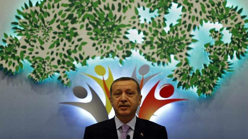Turkey's Prime Minister Tayyip Erdogan delivers his speech during an international conference on the Arab awakening and peace in the Middle East in Istanbul September 7, 2012. REUTERS/Murad Sezer (TURKEY - Tags: POLITICS RELIGION) - RTR37O1J