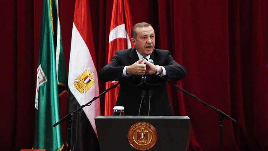 Turkish Prime Minister Tayyip Erdogan delivers a speech at Cairo University after his meeting with the Egyptian President Mohamed Mursi during the first day of his two-day trip to Egypt, November 17, 2012. Erdogan, an outspoken of critic of Israel, praised Egypt's Islamist president Mursi on Saturday for recalling his ambassador from Tel Aviv in response to Israeli attacks on Gaza. REUTERS/Asmaa Waguih (EGYPT - Tags: POLITICS TPX IMAGES OF THE DAY) - RTR3AJ7X