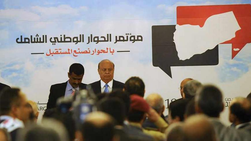 Yemen's President Abd-Rabbu Mansour Hadi attends the opening of a national dialogue conference in Sanaa March 18, 2013. Yemeni leaders trying to end political upheaval and separatist demands met to chart a new constitution on Monday, the scale of their task underscored by protesters who marched in their tens of thousands in the south to demand their own state. REUTERS/Mohammed Hamoud (YEMEN - Tags: POLITICS) - RTR3F5HT