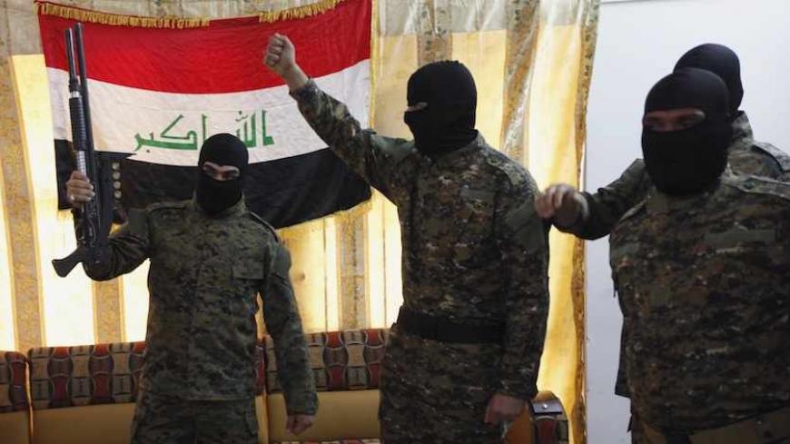 Fighters from Iraq's Islamist Shi'ite militias celebrate before departing to Syria from Baghdad, June 11, 2013. Syria is splintering the Middle East along a divide between the two main denominations of Islam, becoming a battlefield in a proxy war between Assad's main regional ally, Shi'ite Iran, and his Sunni enemies in Turkey and the Gulf Arab states. As the Syrian war grinds into its third year, sectarian killings are increasing, while hardline Sunni clerics are declaring Jihad or holy war on the Shi'ites