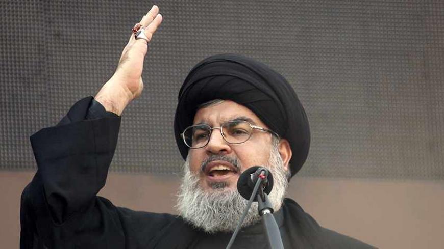 Lebanon's Hezbollah leader Sayyed Hassan Nasrallah addresses his supporters during a religious procession to mark Ashura in Beirut's suburbs November 14, 2013. Ashura, which falls on the 10th day of the Islamic month of Muharram, commemorates the death of Imam Hussein, grandson of Prophet Mohammad, who was killed in the 7th century battle of Kerbala. REUTERS/Khalil Hassan
(LEBANON - Tags: POLITICS RELIGION) - RTX15CVK