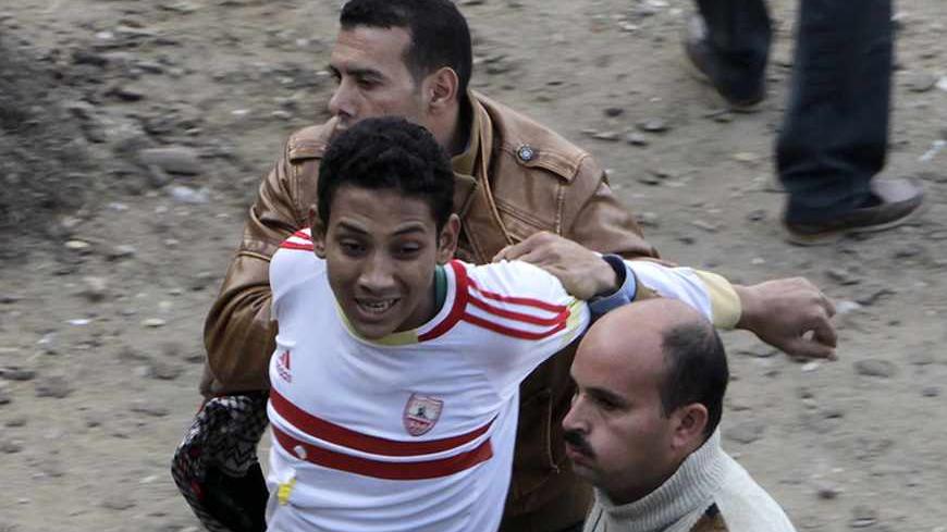 Egyptian security forces detain a supporter of ousted president Mohamed Mursi in Cairo November 29, 2013. Mursi's supporters have staged frequent protests across Egypt, many of them after Friday prayers, since the army deposed him on July 3 in response to mass protests against his rule, and arrested most of the top leaders of his Muslim Brotherhood. REUTERS/Mohamed Abd El Ghany  (EGYPT - Tags: POLITICS CIVIL UNREST) - RTX15XKL