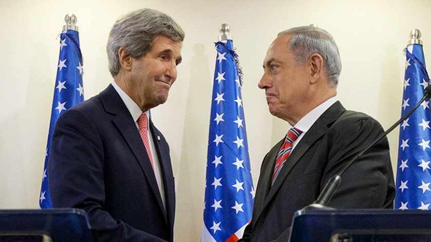 U.S. Secretary of State John Kerry (L) shakes hands with Israeli Prime Minister Benjamin Netanyahu after a joint news conference at the Prime Minister's Office in Jerusalem, December 5, 2013. Kerry said on Thursday that some progress had been made in Israeli-Palestinian peace talks and that he had presented Israel with ideas for improving its security under any future accord. REUTERS/Pablo Martinez Monsivais/Pool (JERUSALEM - Tags: POLITICS) - RTX164LE