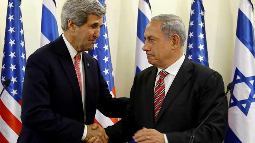  U.S. Secretary of State John Kerry shakes hands with Israeli Prime Minister Benjamin Netanyahu (R) during a news conference following a meeting at Netanyahu's office in Jerusalem December 5, 2013. Kerry said on Thursday that some progress had been made in Israeli-Palestinian peace talks and that he had presented Israel with ideas for improving its security under any future accord. REUTERS/Gali Tibbon/Pool (JERUSALEM - Tags: POLITICS) - RTX164NX