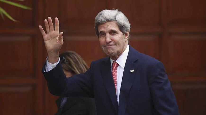 U.S. Secretary of State John Kerry waves upon arrival for a meeting with Palestinian President Mahmoud Abbas in the West Bank city of Ramallah December 5, 2013. Kerry said on Thursday that some progress had been made in Israeli-Palestinian peace talks and that he had presented Israel with ideas for improving its security under any future accord. REUTERS/Mohamad Torokman (WEST BANK - Tags: POLITICS) - RTX164OT