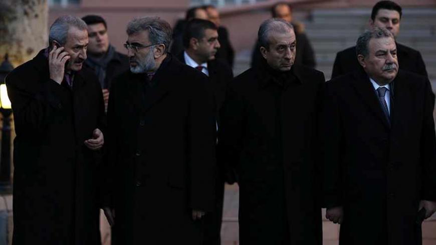 (L-R) Ministers of Turkey's ruling Ak Party (AKP) Economy Minister Zafer Caglayan, Energy Minister Taner Yildiz, Agriculture Minister Mehdi Eker and Interior Minister Muammer Guler attend a ceremony in Ankara December 18, 2013.Scores of people including the sons of Interior Minister Guler, Economy Minister Caglayan and Environment and City Planning Minister Erdogan Bayraktar, prominent businessmen close to Prime Minister Tayyip Erdogan, and local government officials were detained on Tuesday in the biggest 