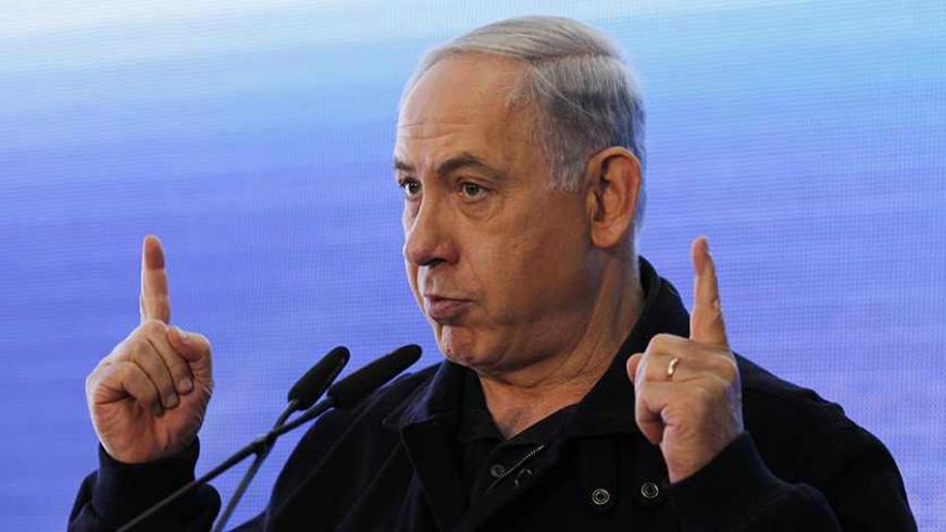 Israeli Prime Minister Benjamin Netanyahu gestures as he speaks during an inauguration ceremony of a new train station in the southern town of Sderot, close to the Gaza Strip border December 24, 2013. REUTERS/Amir Cohen (ISRAEL - Tags: HEADSHOT POLITICS) - RTX16T9J