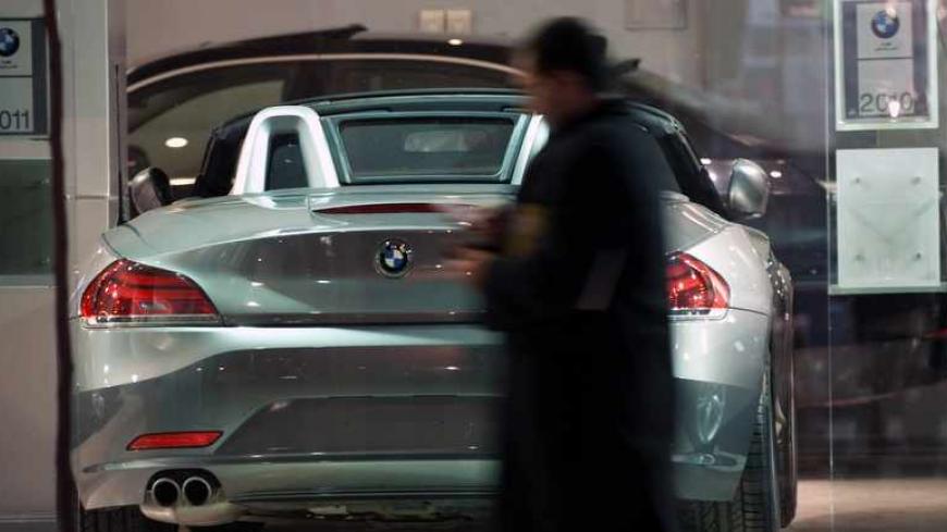 EDITORS' NOTE: Reuters and other foreign media are subject to Iranian restrictions on leaving the office to report, film or take pictures in Tehran.

An Iranian man walks past a BMW displayed at a car shop in central Tehran March 1, 2012. REUTERS/Morteza Nikoubazl (IRAN - Tags: SOCIETY BUSINESS TRANSPORT) - RTR2YP9L