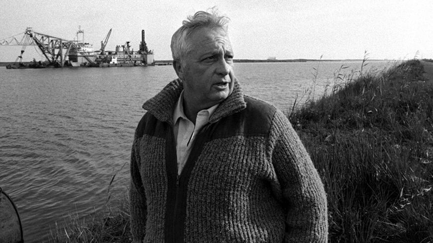 Israeli Defence Minister Ariel Sharon stands on the banks of the Suez Canal following an official visit to Egypt January 21, 1982 in this handout photo by the Government Press Office. Surgeons battled to keep Sharon alive on January 5, 2006 after a massive brain haemorrhage felled the Israeli prime minister in the midst of his fight for re-election on a promise to end conflict with the Palestinians. ISRAEL OUT BW ONLY REUTERS/Moshe Milner/Government Press Office/Handout - RTR17SNX
